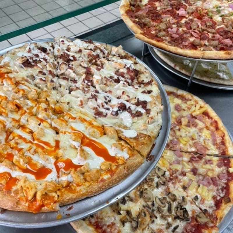 several pizzas ready for customers in a case at Miseno's 1 in Carlisle, pa